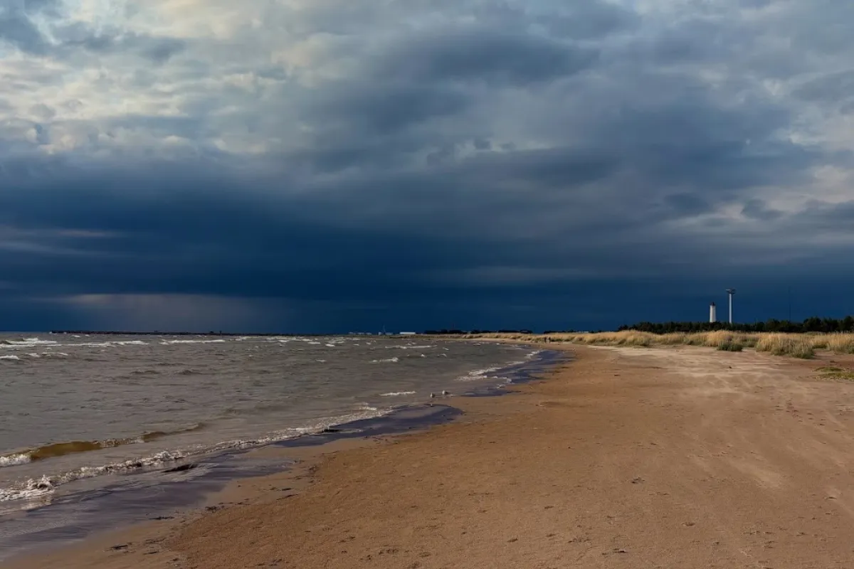Darkening skies over the Bothnian Bay as a summer storm approaches, seen from Sumpu toward Marjaniemi lighthouse.